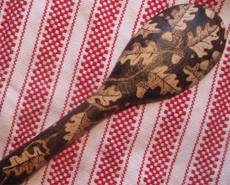 burned wooden spoon pattern leaves acorns